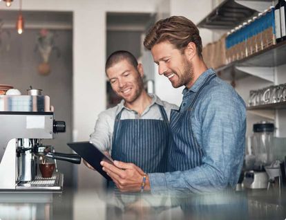 Two restaurants employee chatting at a table