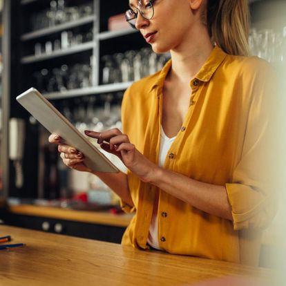 A woman using the TouchBistro software