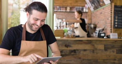 restaurant owner working on tablet