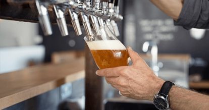 Bartender pouring draft beer