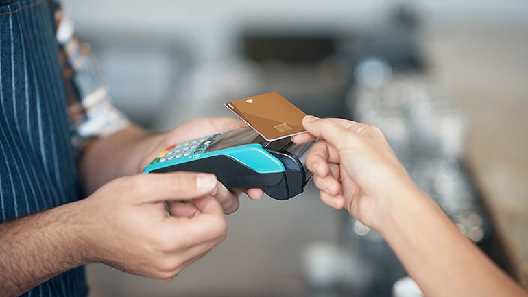 A customer paying with credit card to credit card processor