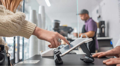 customer ordering at counter on self-serve EPOS