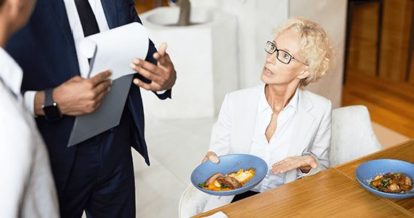 Dissatisfied customer complaining to restaurant employees about a dish