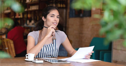 restaurant manager working through restaurant finances