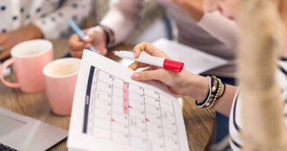 manager highlighting dates on employee schedule