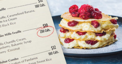 A plate of pancakes and a menu with the calorie amount circled