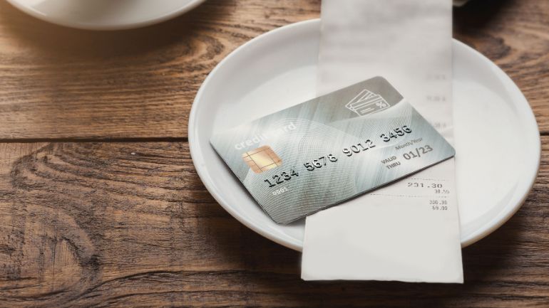 Credit card on a bill on a dish