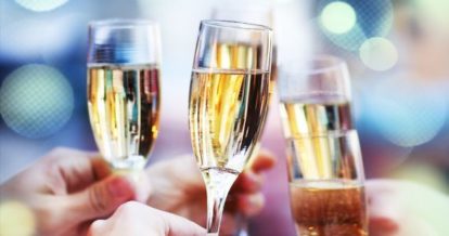 Friends raising glasses of sparkling wine