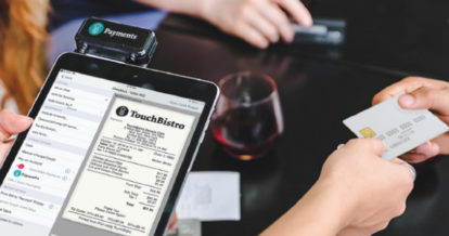 Customer paying for bill shown on TouchBistro's iPad software powered by Chase