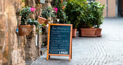 A sidewalk sign with specials written in chalk