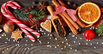 Holiday decorations laid out on a dark wooden table