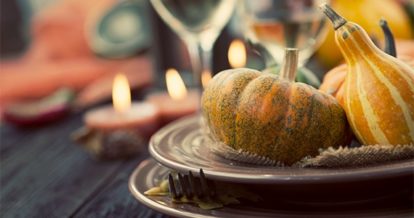 Pumpkins and gourds on a thanksgiving table setting
