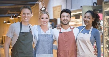 Coworkers standing together smiling