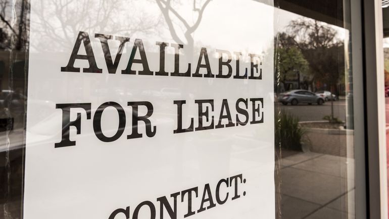 Restaurant for lease with an "available for lease" sign in the window