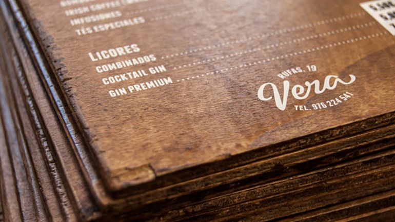 A menu on a wooden slate
