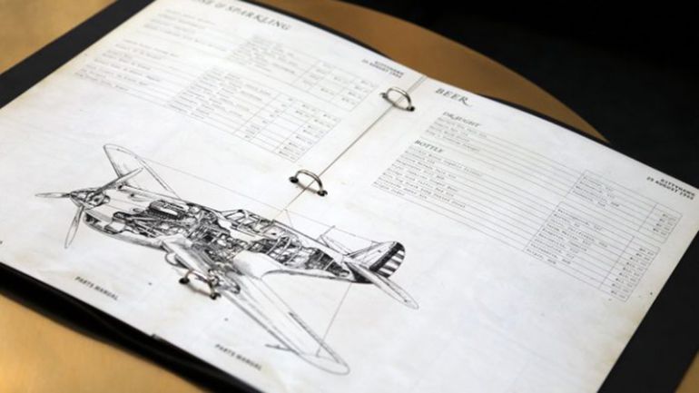 A menu with an illustration of a plane