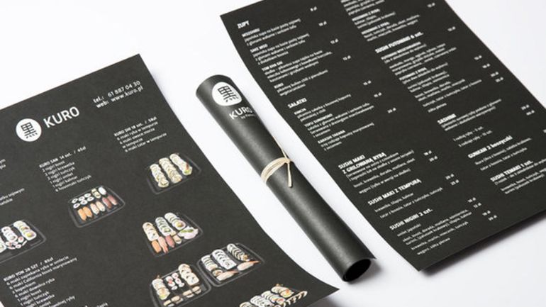 A black menu that looks like a maki roll when rolled up