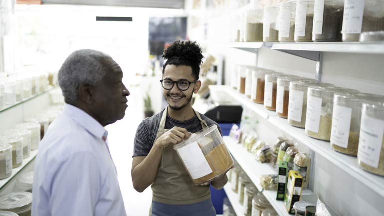 Store owner talking to a customer