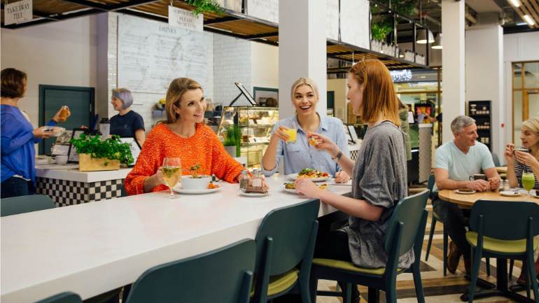 A group of women eating at a restaurant