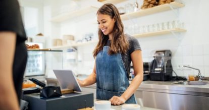 server taking order at counter POS