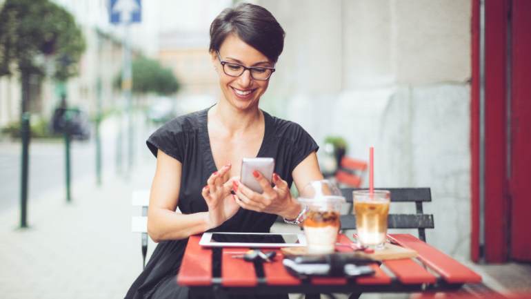 A woman eating at a patio for lunch