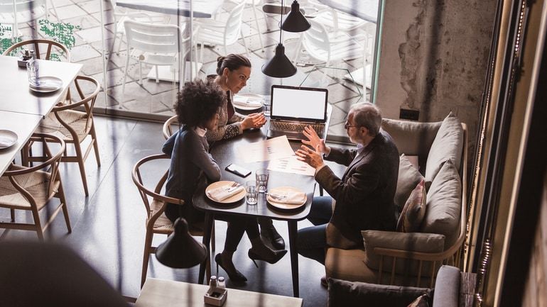 Business people having a meeting in a restaurant