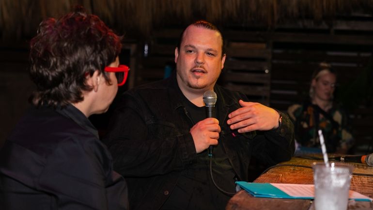 Brad Kilgore sitting on stage talking into microphone at Miami Industry Sessions