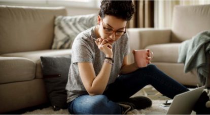 restaurant staff member at home on lounge floor