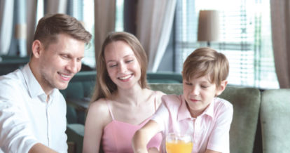 Small family at a restaurant celebrating fathers day