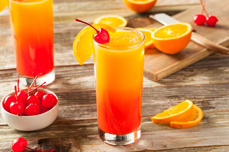 A tequila based well drink with cherries and oranges