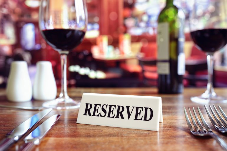 a reserved sign on a table at a restaurant