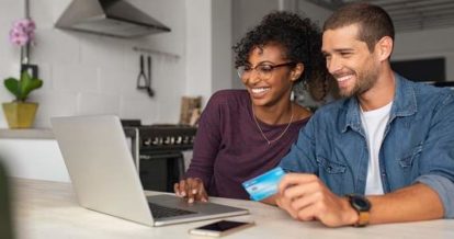 Couple making an online order on a laptop