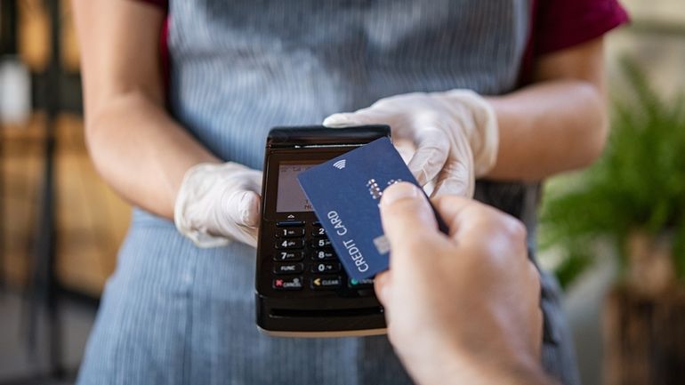 Customer using contactless payments at a restaurant