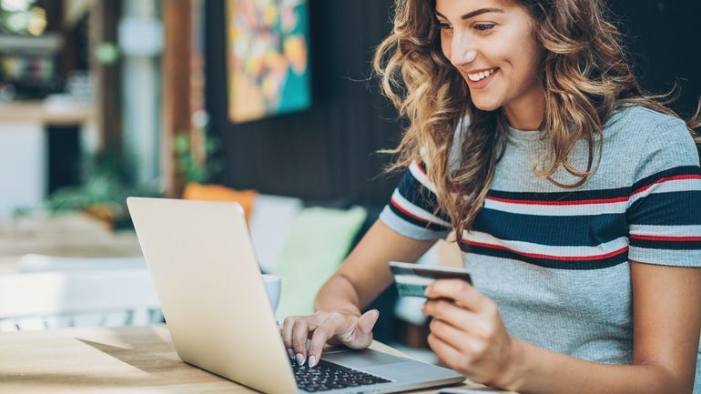 Woman online shopping with a credit card