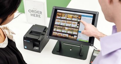 customers ordering from self-serve kiosk