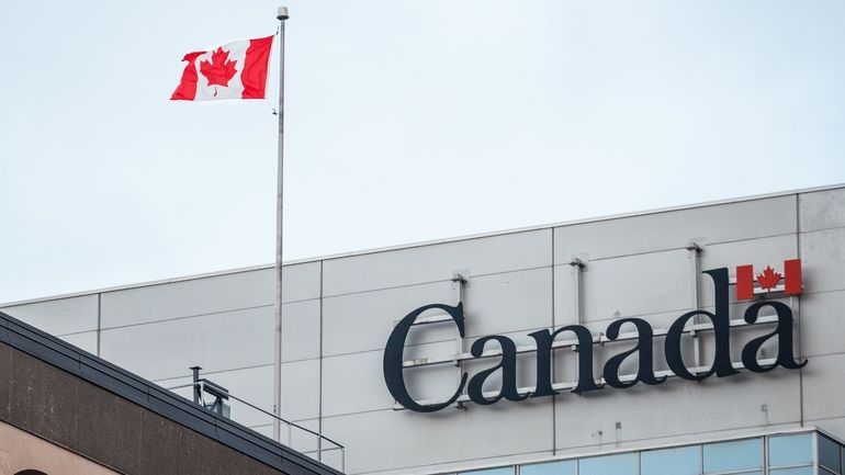 Canadian flag in front of a government building