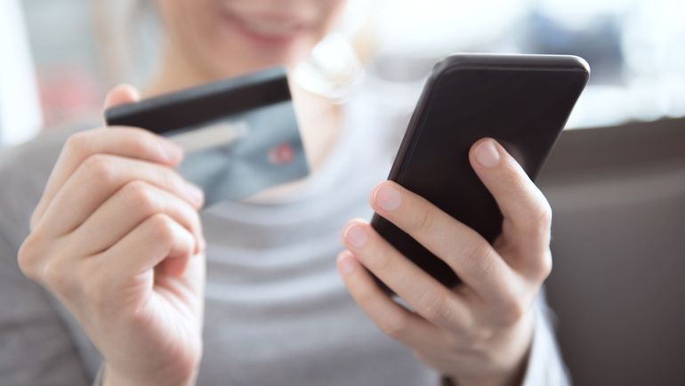 Woman shopping online with a mobile phone