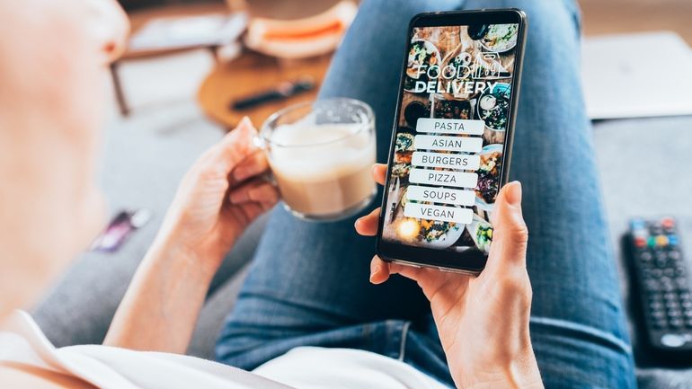 Customer browsing food order choices on smart phone