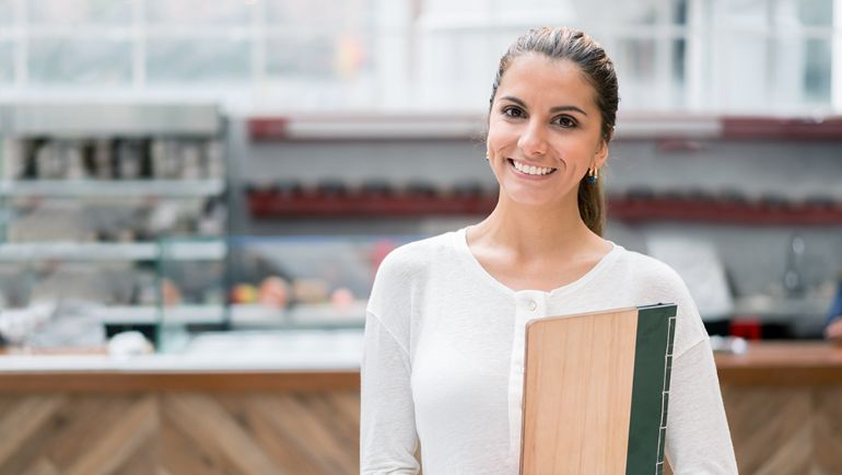 Restaurant hostess smiling