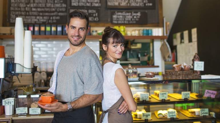 Two business owners in their restaurant