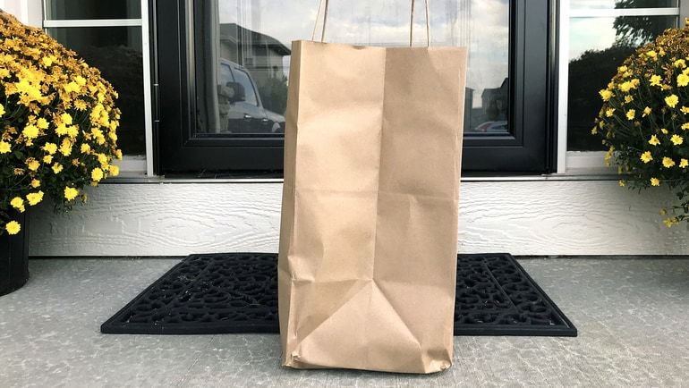 Food delivery bag waiting at the front door of a home