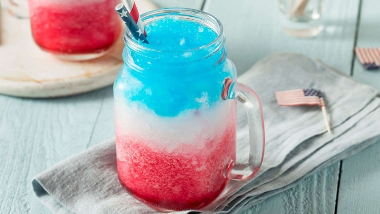 Red white and blue frozen drink in a mason jar.