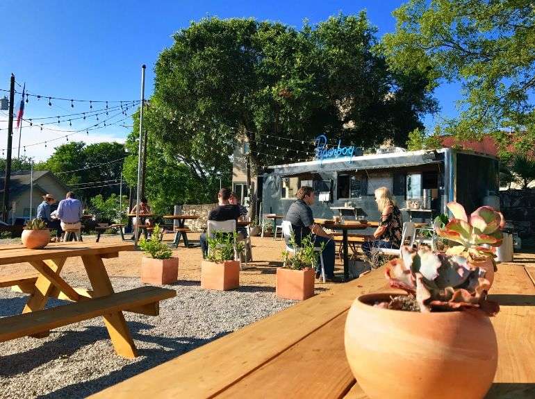 Patio seating in front of a food truck