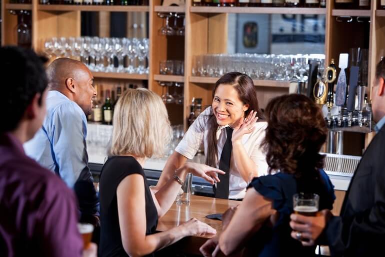 Bartender chatting with patrons