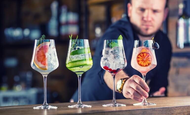 Bartender serving cocktails