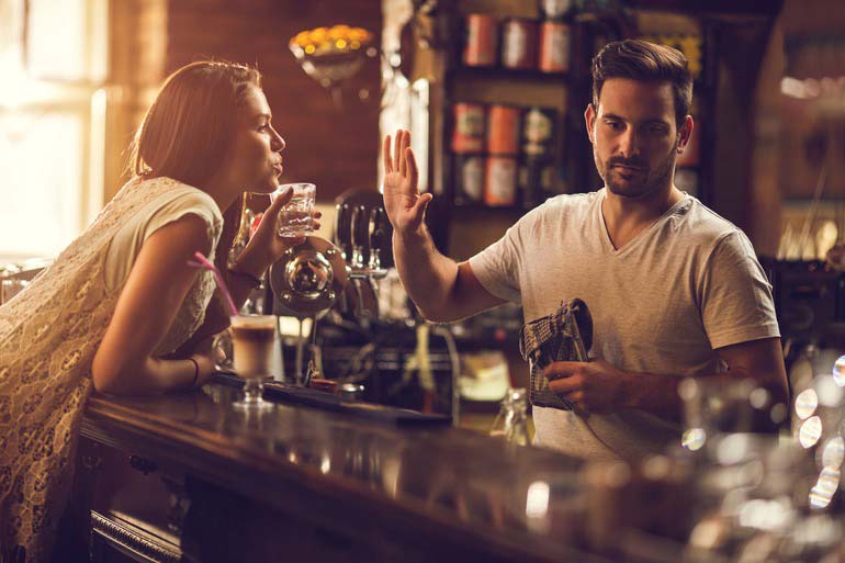 Bartender cutting a patron off