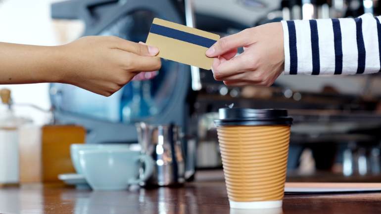 Customer paying for coffee with card