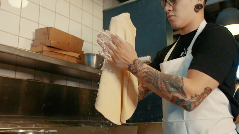 chef making pizza for the restaurant competition