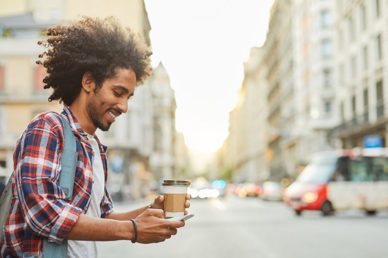 Customer on the go with take away coffee