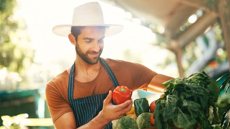 Restaurant worker looking at fresh produce